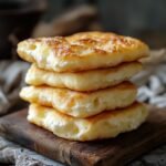 How to Make Fluffy Cottage Cheese Cloud Bread — A Light, Low-Carb Favorite 2 Unbaked fluffy cloud bread portions on tray