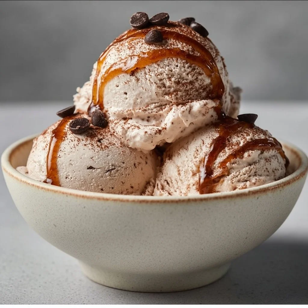 Low calorie coffee cottage cheese ice cream in a bowl topped with cocoa