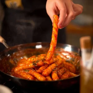 Delicious vegan tteokbokki featuring chewy potato noodles in a spicy sauce.